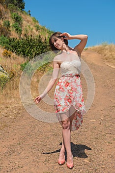 Brunette on a dirt road