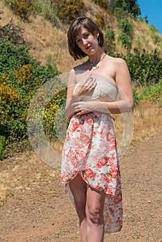 Brunette on a dirt road