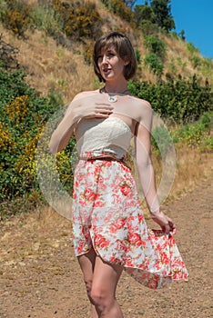 Brunette on a dirt road