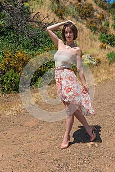 Brunette on a dirt road