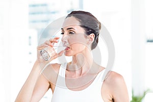 Brunette drinking water