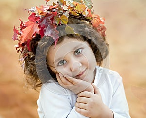 Brunette girl in a autumn crown