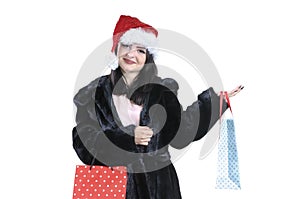 Brunette girl in black fur coat, in santa hat on isolated background portrait Christmas shopping, sale