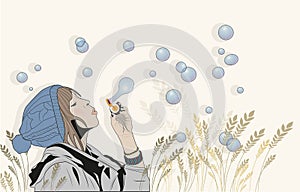 Brunette girl blowing soap bubbles outdoors.