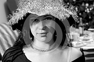 Brunette girl face in witch costume. Black and white