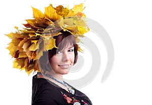 brunette girl with garland of yellow leaves