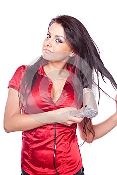 Brunette girl with hair dryer