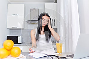 Brunette girl with headache planing day.