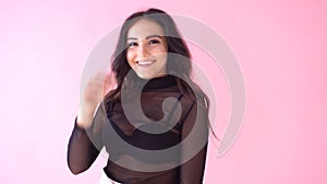 Brunette girl posing on pink background smile emotion