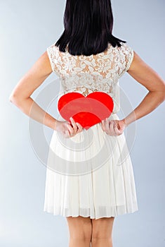 Brunette girl with red Valentine heart