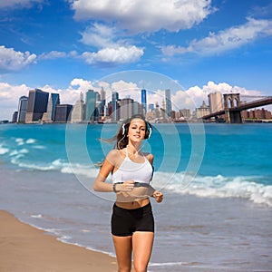 Brunette girl running in New York Brooklyn bridge