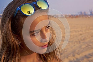 Brunette girl sunglasses with palm tree