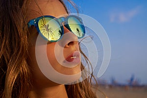 Brunette girl sunglasses with palm tree