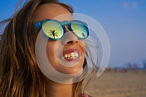 Brunette girl sunglasses with palm tree