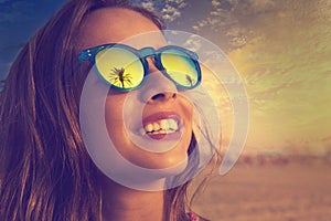 Brunette girl sunglasses with palm tree
