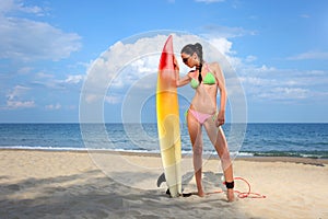 Brunette Girl with a Surfboard photo
