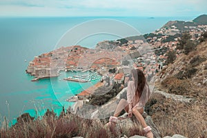 Brunette Girl tourist visiting mountain viewpoint sightseeing i