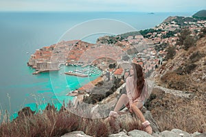 Brunette Girl tourist visiting mountain viewpoint sightseeing i