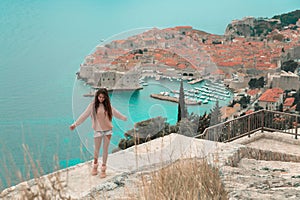 Brunette Girl tourist visiting mountain viewpoint sightseeing i