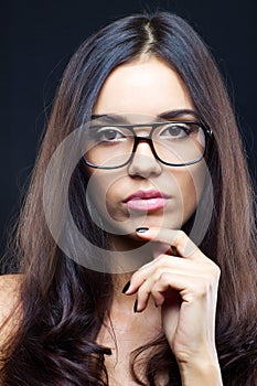 Brunette girl wearing glasses photo