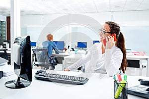 Brunette glasses businesswoman working in office