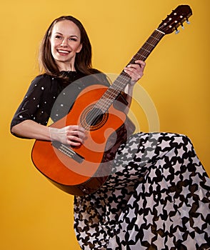 Brunette guitar player woman