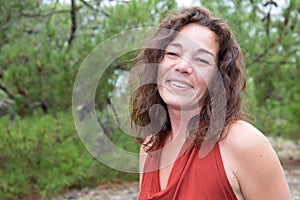 Brunette happy smiling portrait hispanic woman outdoors middle aged face