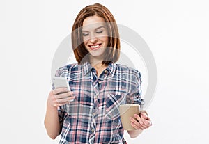Brunette happy woman wearing an plaid shirt using a mobile phone isolated on a white background