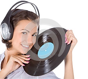 Brunette in headphones with vinyl record