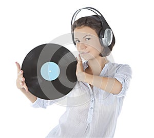 Brunette in headphones with vinyl record