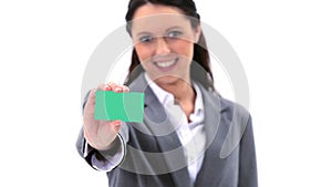 Brunette holding a business card