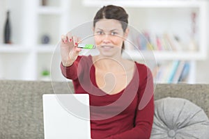 Brunette holding usb key