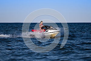 Brunette on a jetski photo