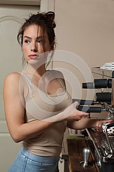 Brunette in kitchen with coffee maker