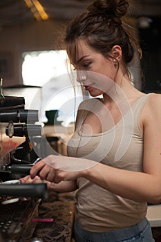 Brunette in kitchen with coffee maker