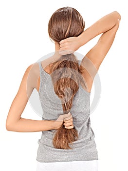 Brunette lady holding long hairs from back