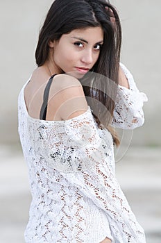 Brunette lady wear white gauzy shirt