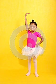 Brunette Latina girl with autism spectrum disorder (ASD) takes ballet dance therapy to express herself and communicate