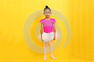 Brunette Latina girl with autism spectrum disorder (ASD) takes ballet dance therapy to express herself and communicate