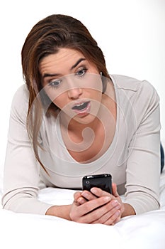 Brunette laying on her bed