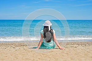 Brunette with long hair turned away