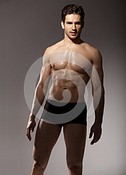 Brunette man with fit body photo
