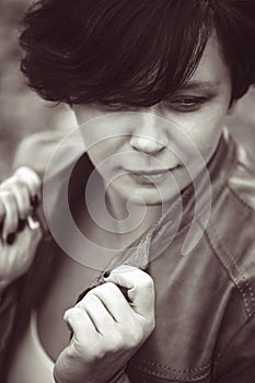 Brunette middle aged woman outside in autumn park