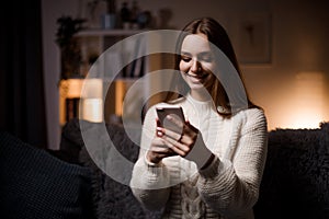 Brunette with mobile at home