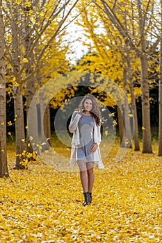 Brunette Model Enjoying A Fall Day In Fall Foliage