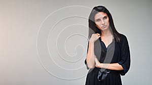 Brunette model girl wearing stylish black dress. woman portrait with perfect makeup, Beauty trends. panoramic photo