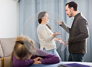 Brunette mother and father arguing with each other