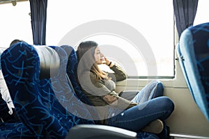 Brunette Relaxing In Bus Journey