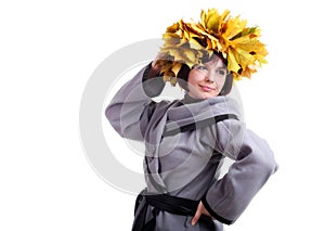 brunette short-haired girl in grey with yellow leaves garland