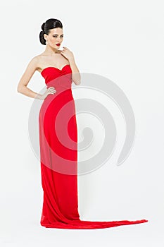 brunette in a slinky bright red evening dress